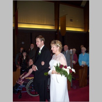 _Paul_Olchvary_Merchant_escorting_his_mo.,_Shirley_Olchvary_down_the_aisle,_Nov._2008.JPG